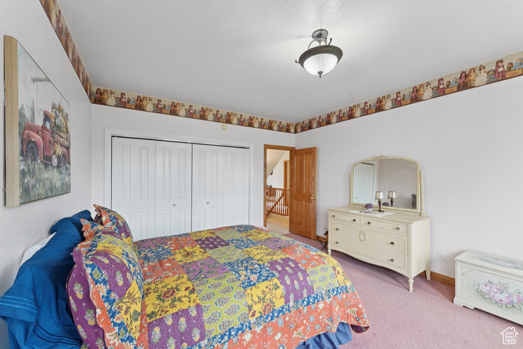 Bedroom with carpet flooring and a closet