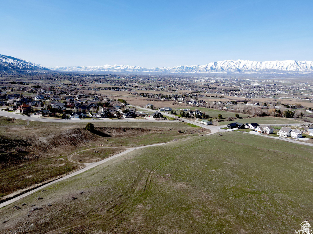 Aerial perspective of suburban area featuring a mountain backdrop