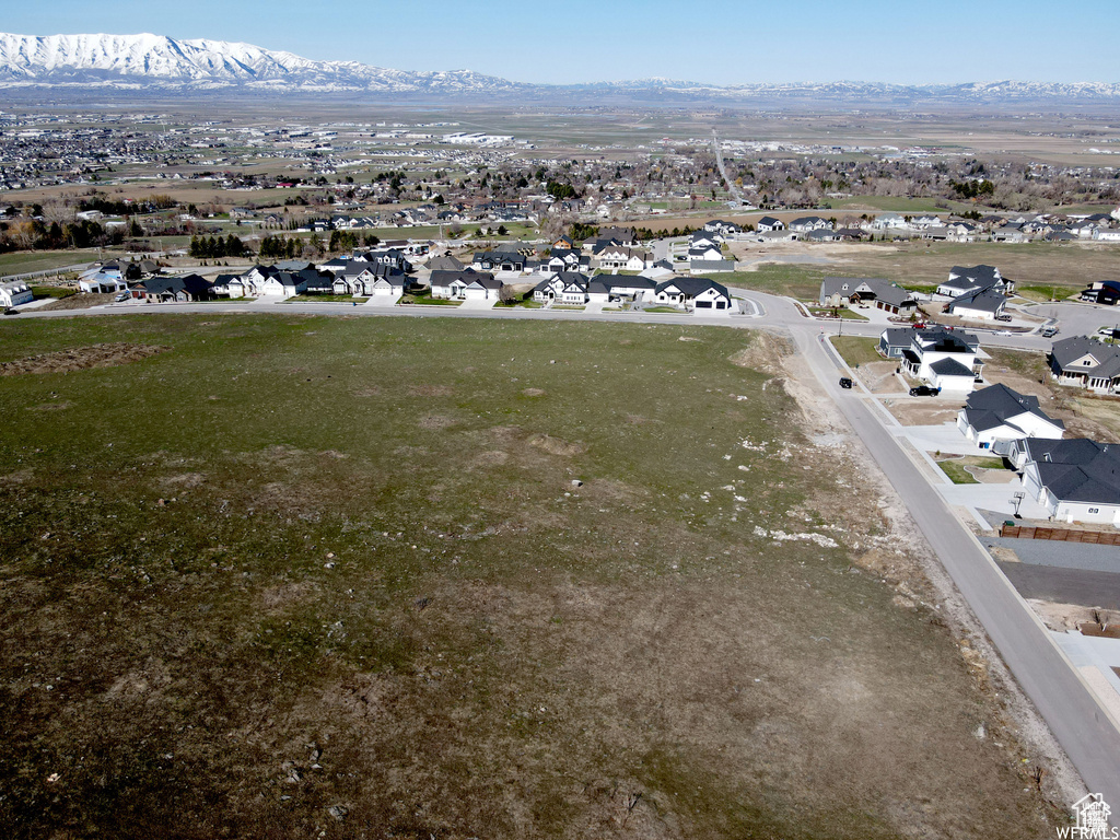 Aerial view of residential area with a mountainous background