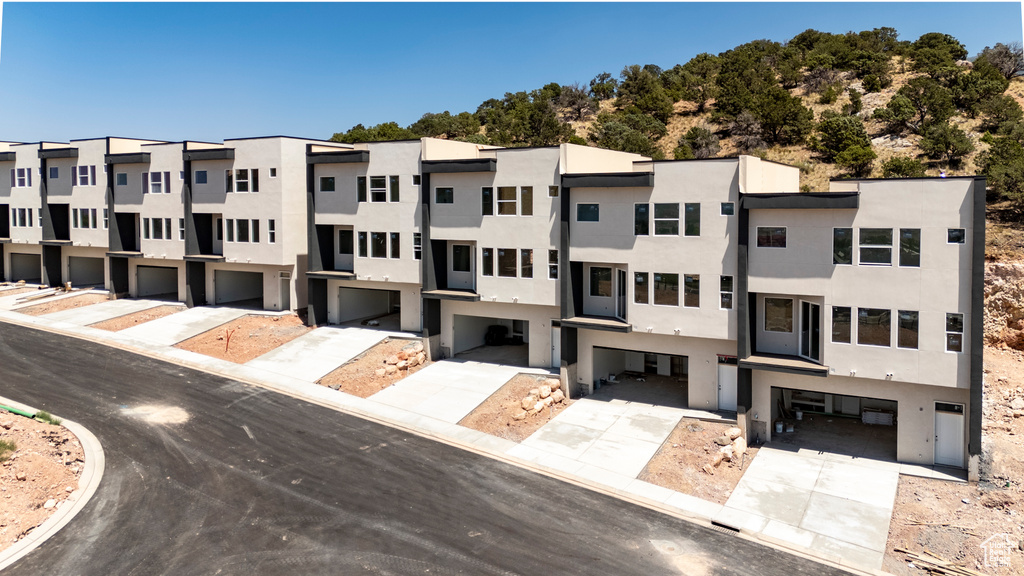 View of property with a residential view