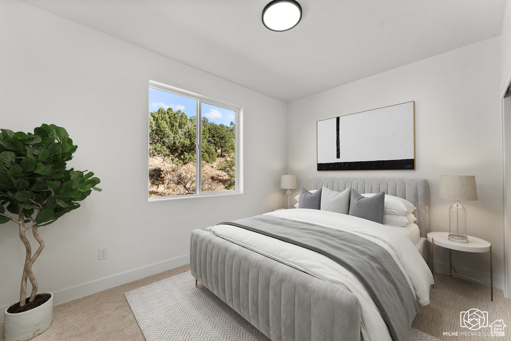 Carpeted bedroom with baseboards