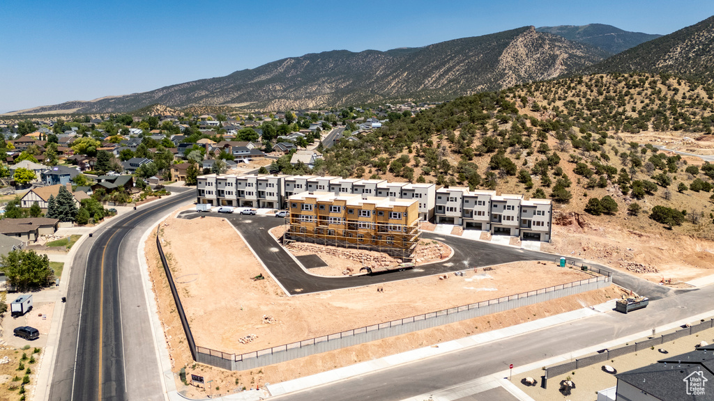 Aerial view of residential area featuring a mountain backdrop