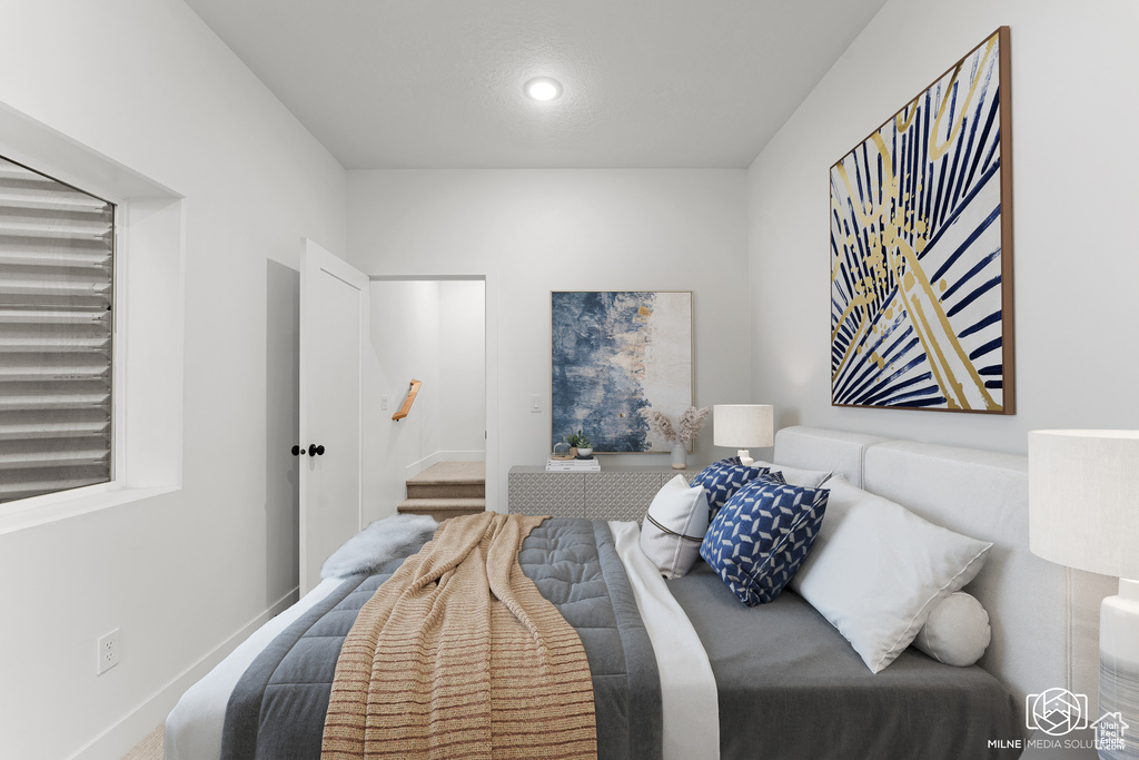 Bedroom featuring baseboards and recessed lighting