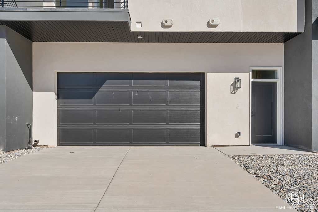 Garage with concrete driveway