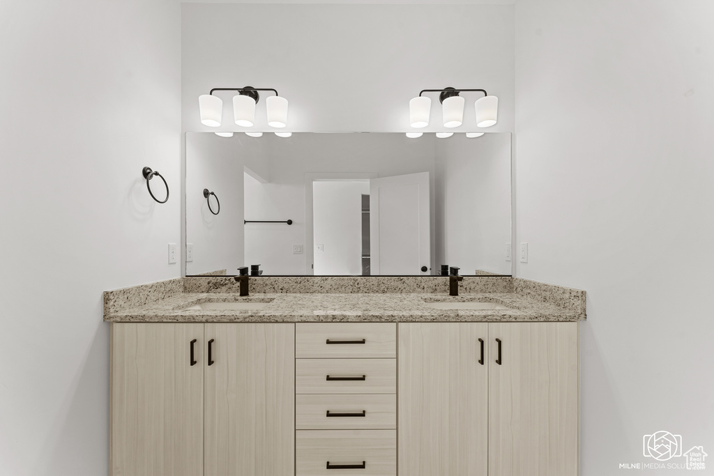 Full bath featuring double vanity