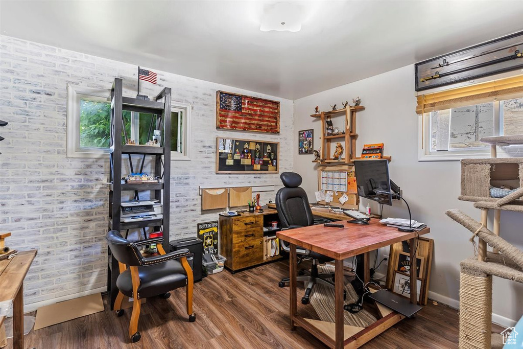 Office space with healthy amount of natural light and wood finished floors