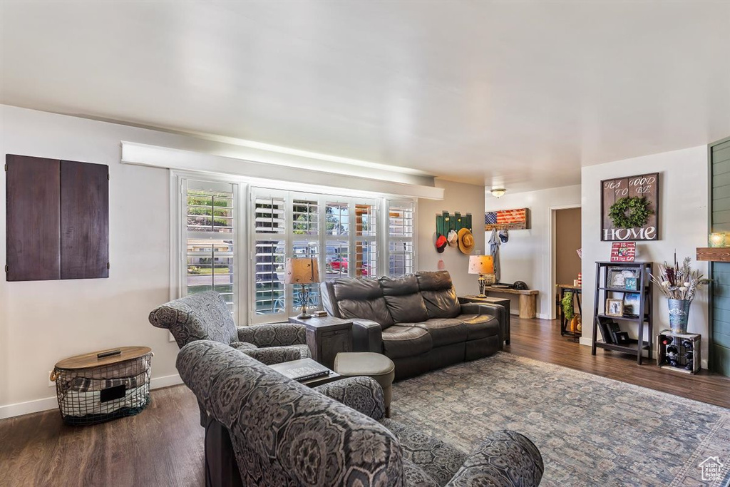 Living room featuring wood finished floors and baseboards