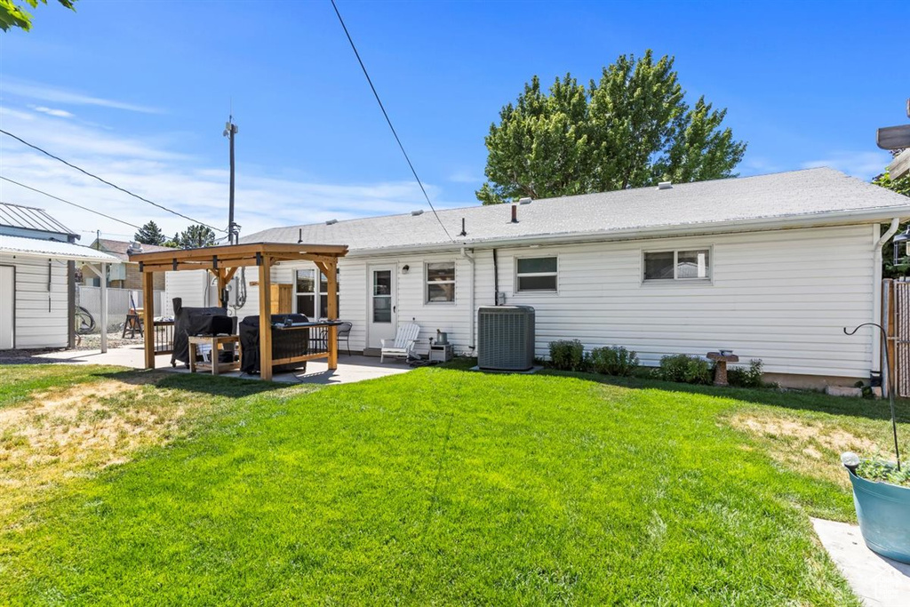 Rear view of house featuring a patio and an outdoor hangout area