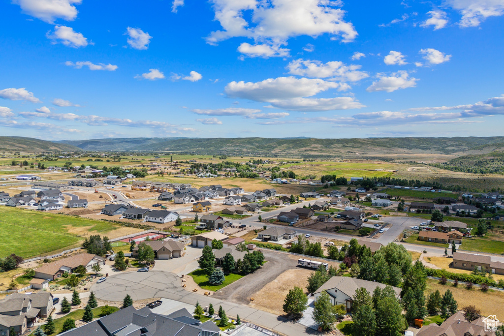Aerial perspective of suburban area featuring a mountainous background