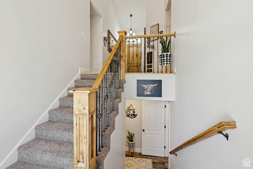 Stairs featuring baseboards and wood finished floors