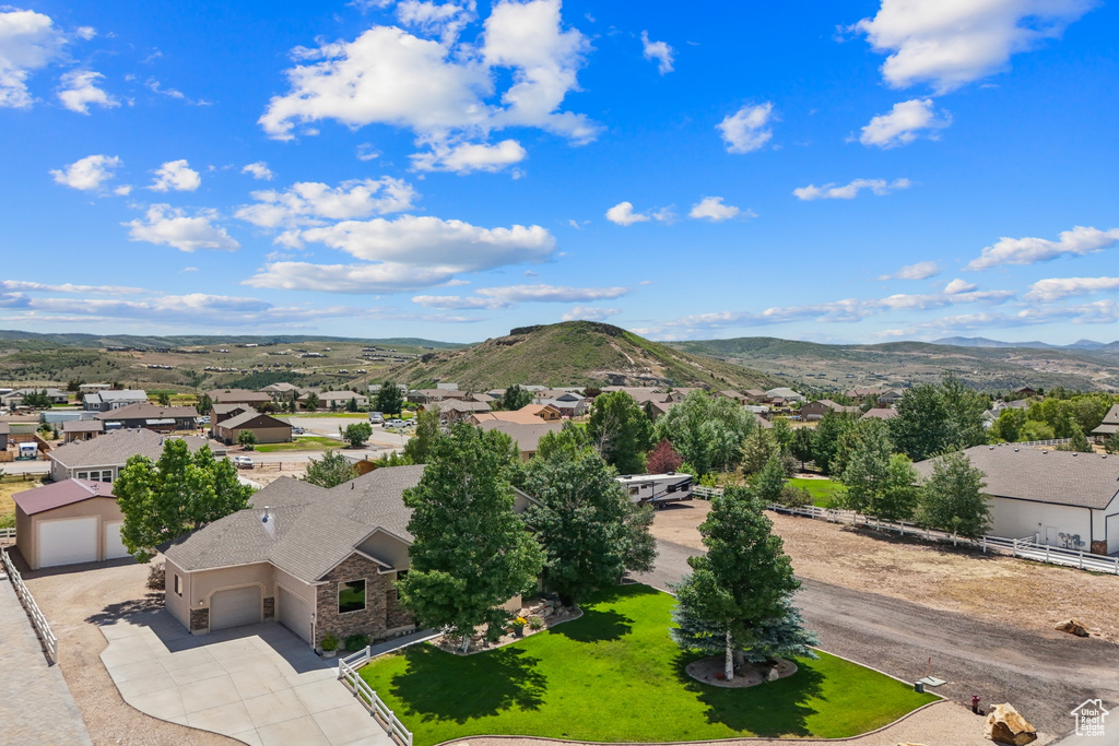 Aerial view of residential area featuring mountains