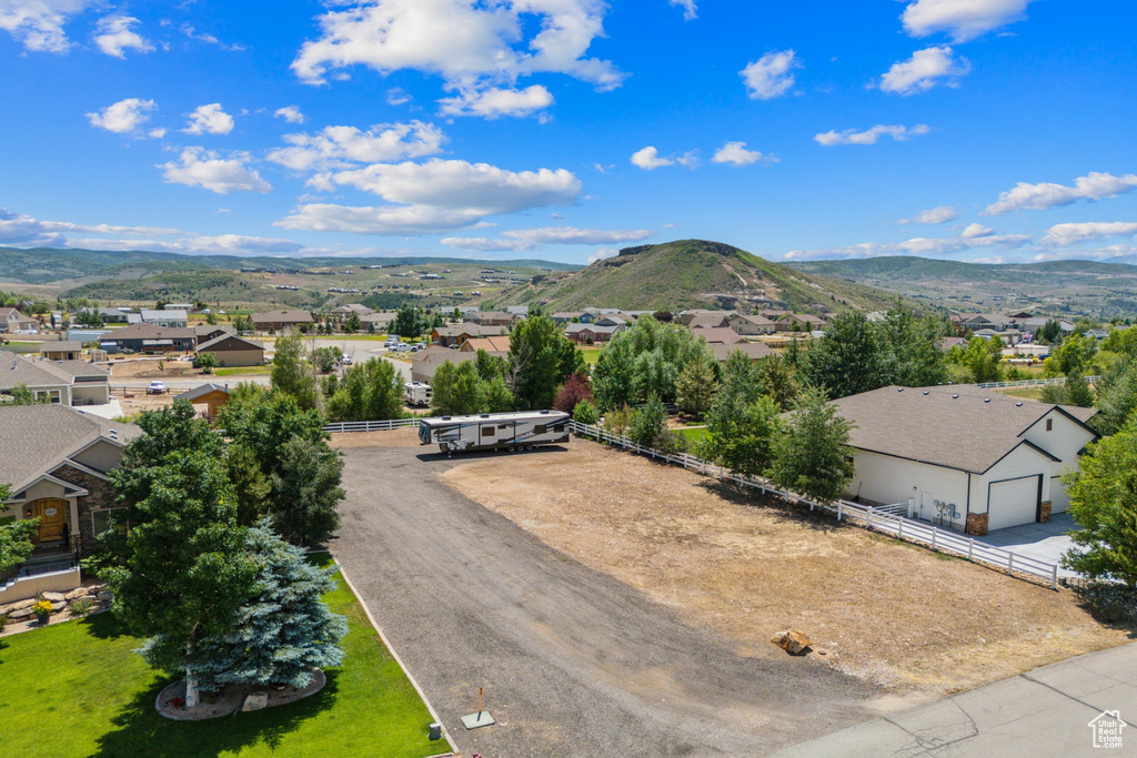 Aerial perspective of suburban area with a mountainous background
