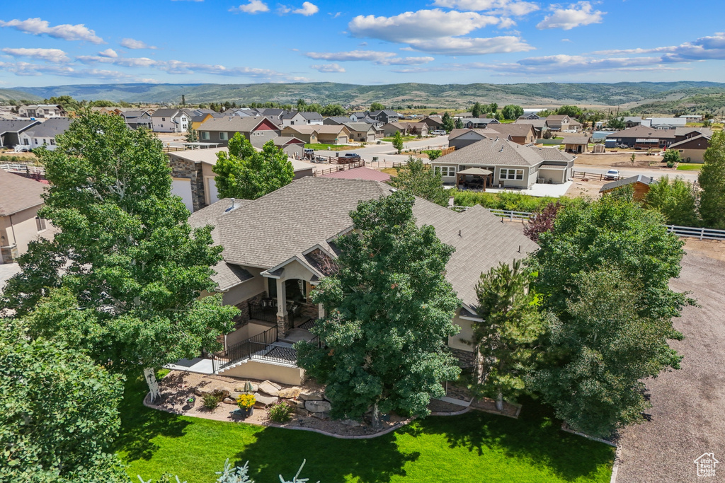 Aerial perspective of suburban area with a mountain backdrop