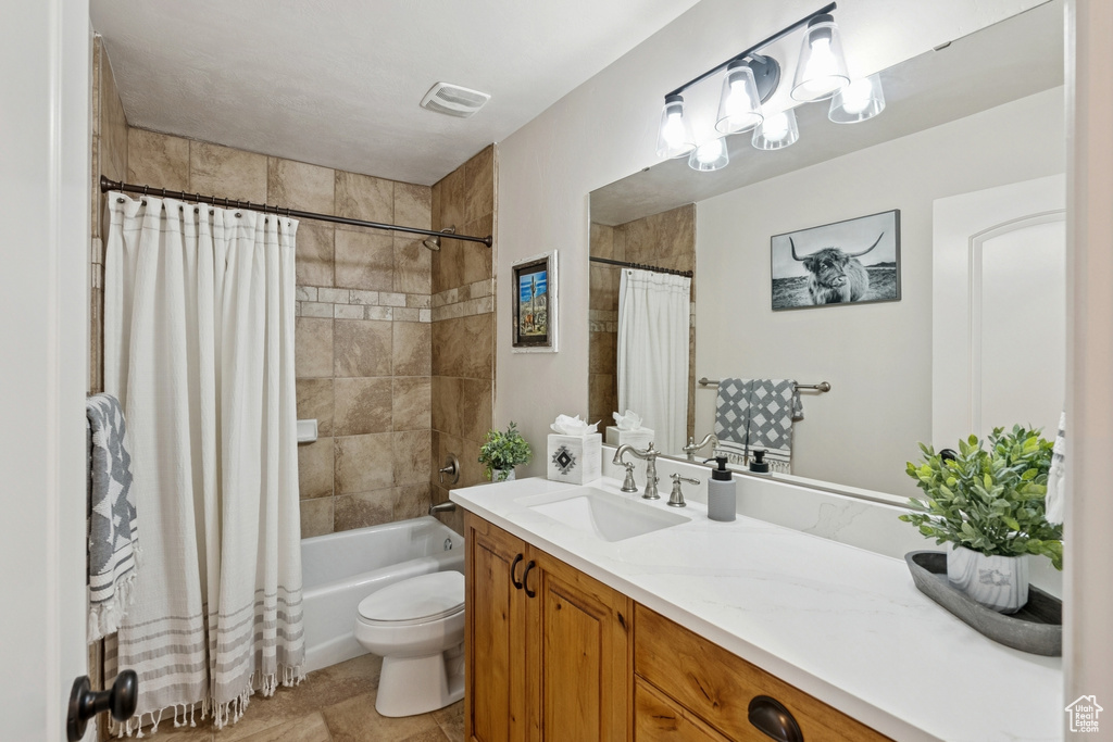 Full bathroom with vanity and shower / bath combo