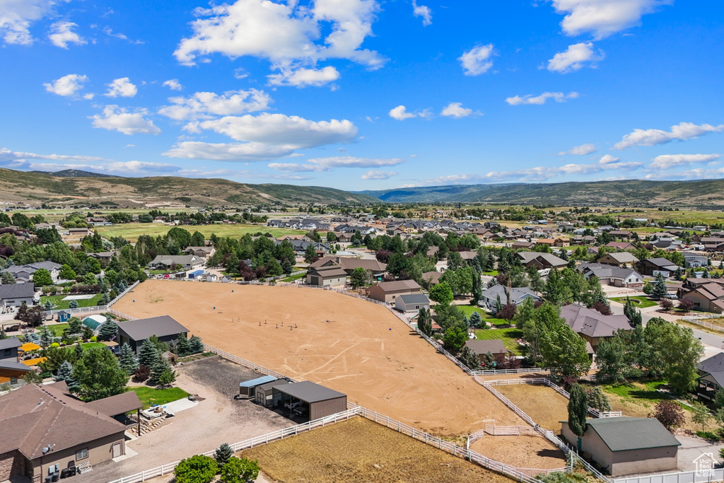 Aerial perspective of suburban area with a mountainous background