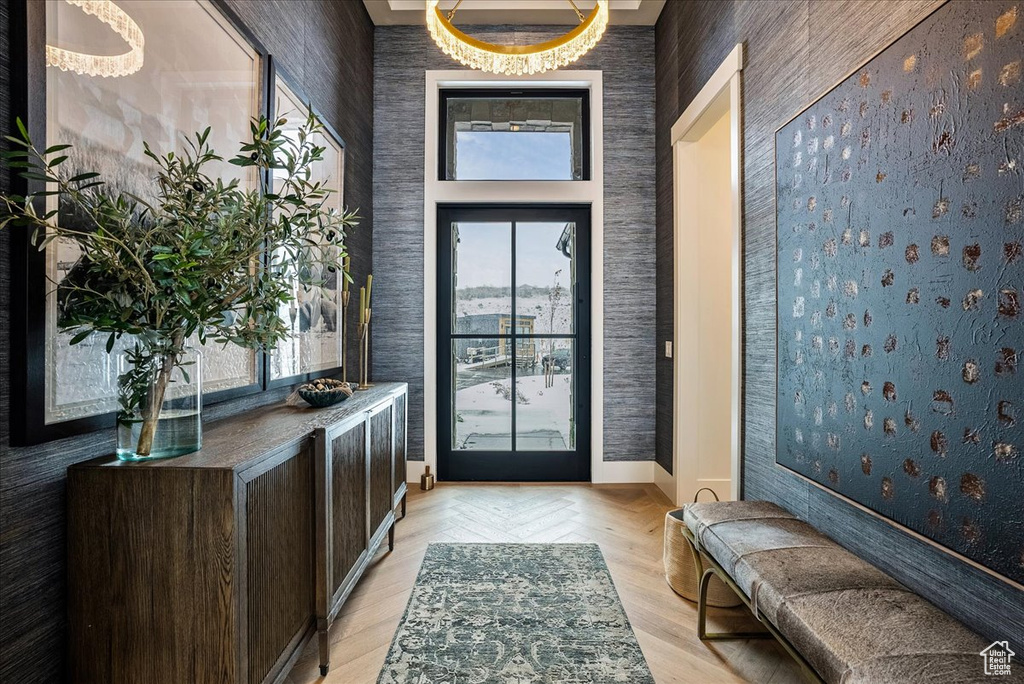 Entryway featuring wallpapered walls and light wood finished floors