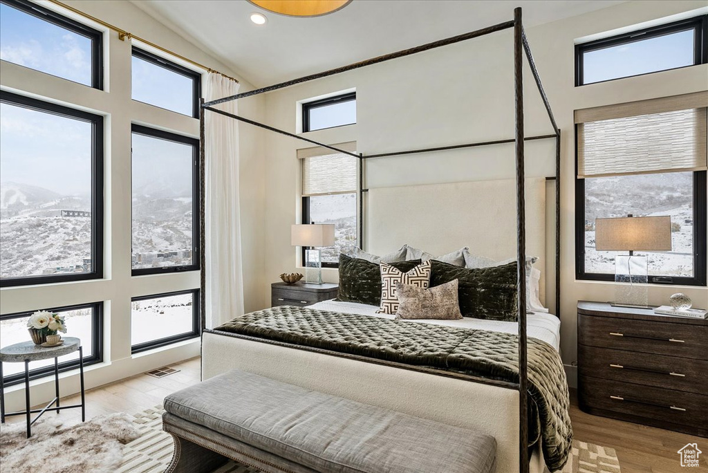 Bedroom featuring wood finished floors and recessed lighting