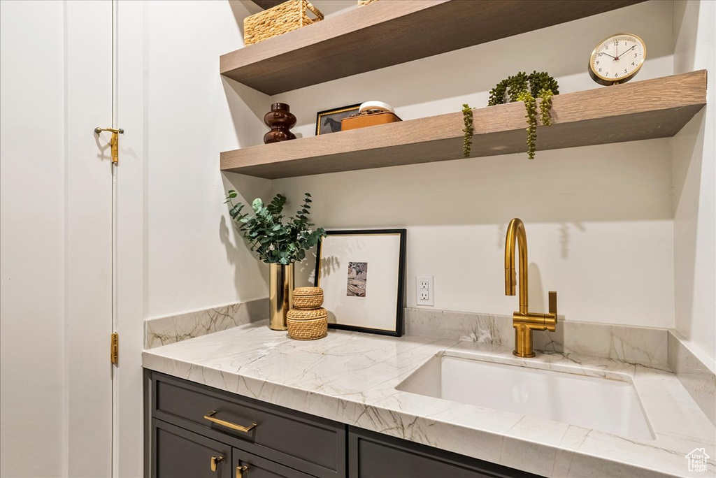 Interior space with open shelves and light stone counters