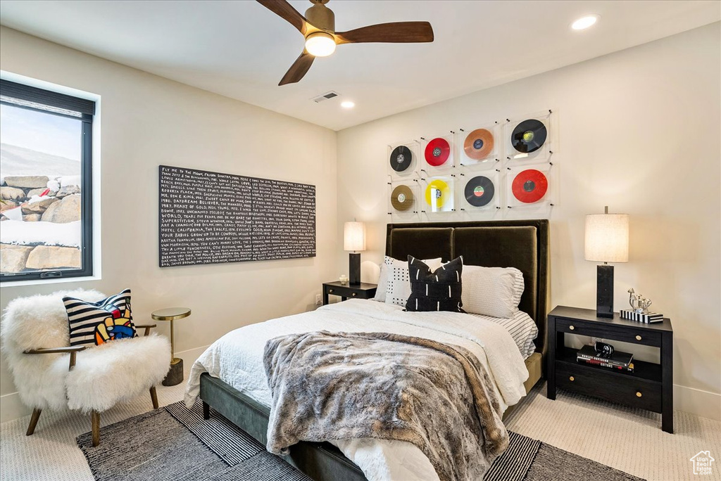 Carpeted bedroom with ceiling fan and recessed lighting