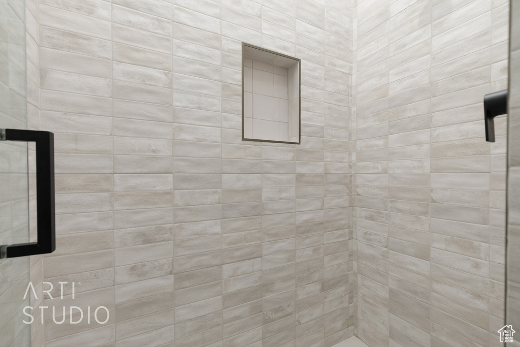 Bathroom featuring tiled shower
