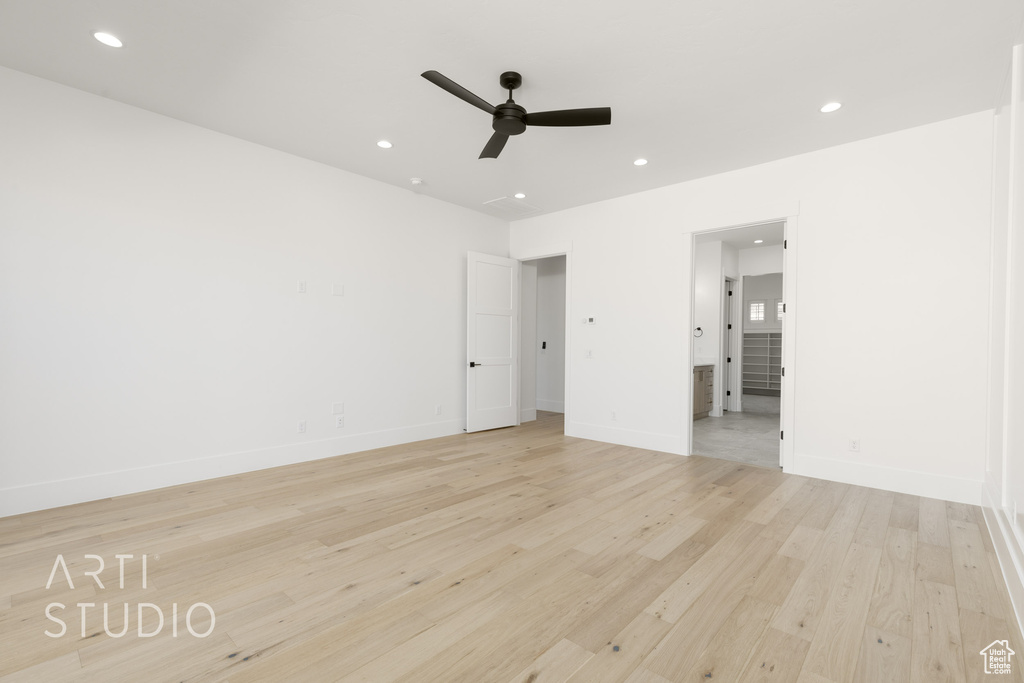Empty room with ceiling fan, recessed lighting, and light wood-style floors