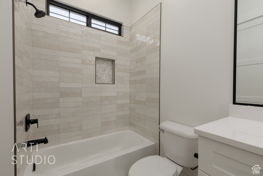 Bathroom with vanity and tub / shower combination