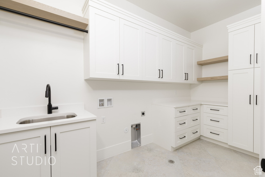Laundry area featuring cabinet space, washer hookup, electric dryer hookup, and gas dryer hookup