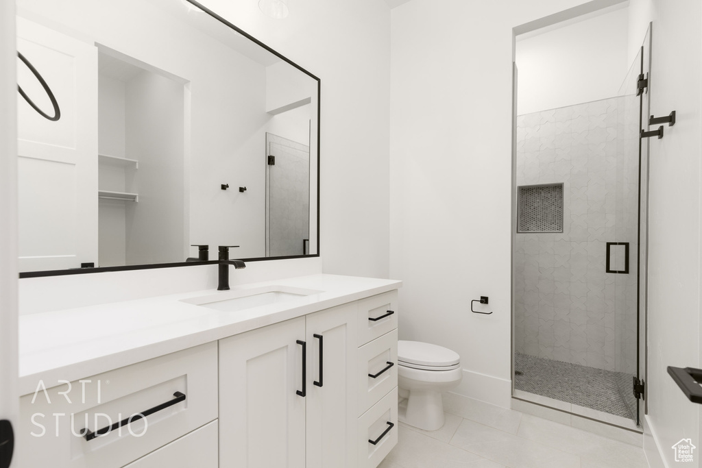 Bathroom featuring vanity and a stall shower