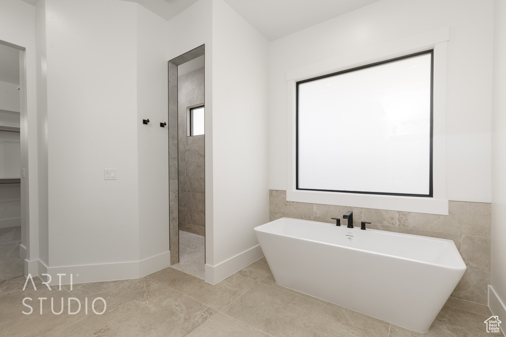 Full bath featuring a freestanding bath