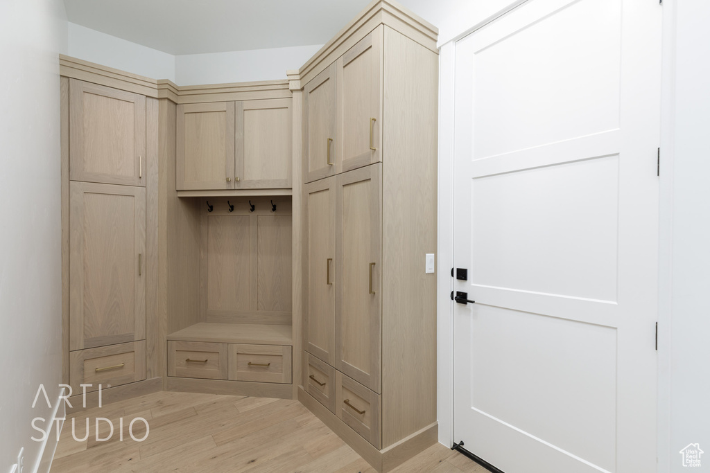 Mudroom with light wood-style flooring