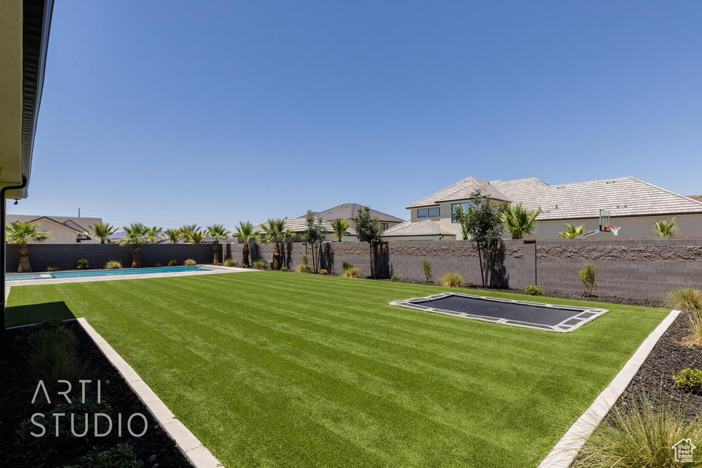 View of fenced backyard