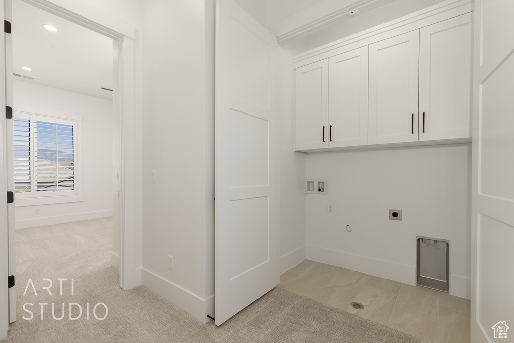 Laundry room with cabinet space, hookup for an electric dryer, washer hookup, gas dryer hookup, and recessed lighting