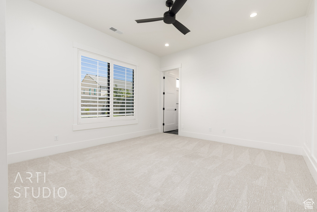 Empty room with carpet floors, ceiling fan, and recessed lighting