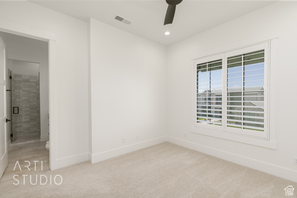 Unfurnished room with a ceiling fan, light carpet, and recessed lighting