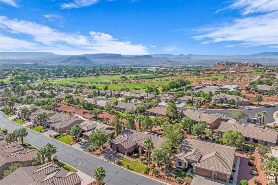 Aerial perspective of suburban area with a mountain backdrop