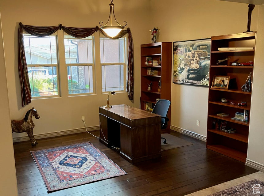 Office space with dark wood-style floors
