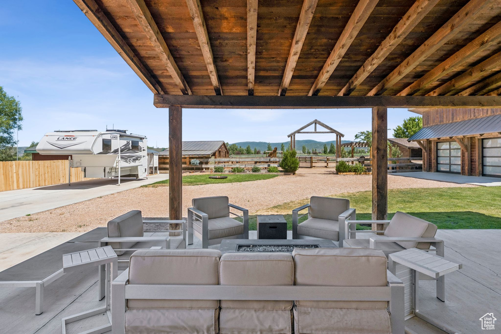 View of patio / terrace with an outdoor living space and a mountain view