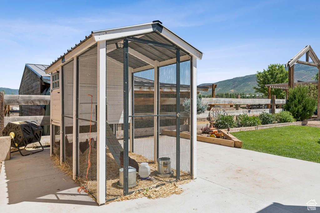 View of poultry coop with a mountain view