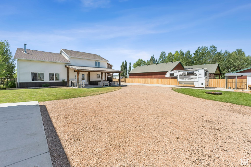 Back of property with a patio