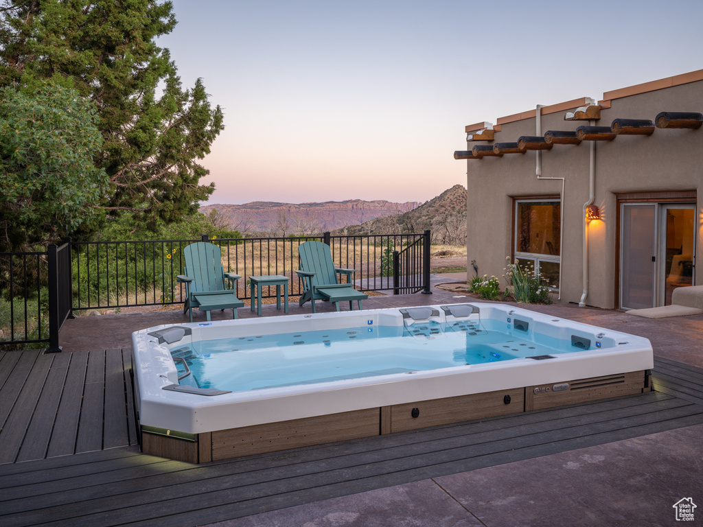 View of swimming pool featuring a deck with mountain view