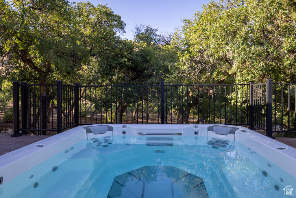 View of pool featuring a pool and a hot tub