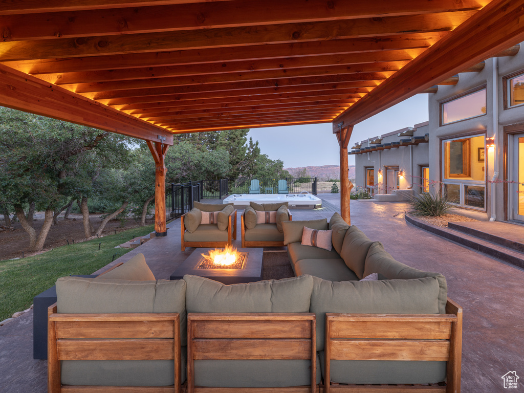 View of patio / terrace featuring an outdoor living space with a fire pit