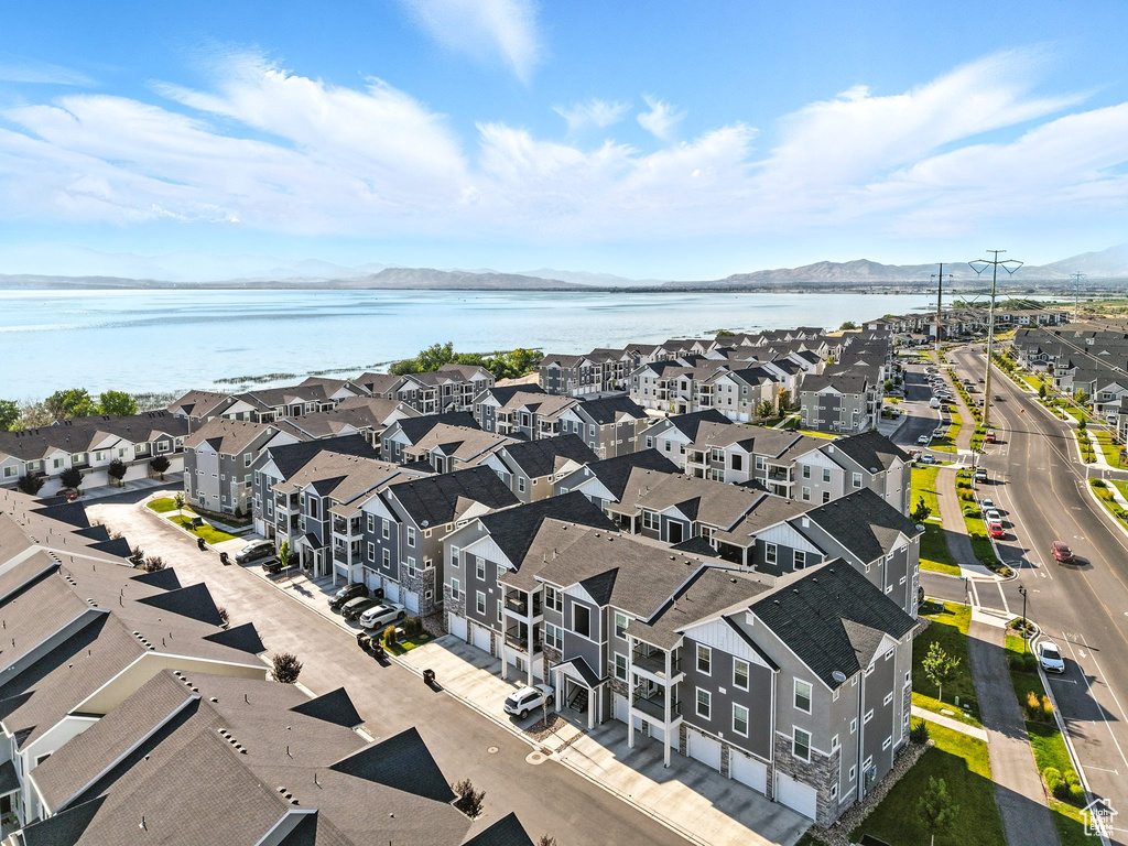 Aerial perspective of suburban area featuring a water and mountain view