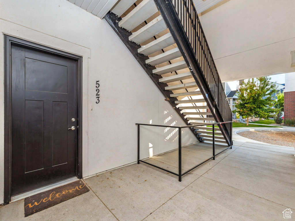 Property entrance featuring stucco siding