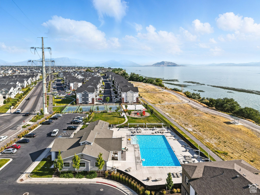 Aerial view of a water and mountain view and a pool area