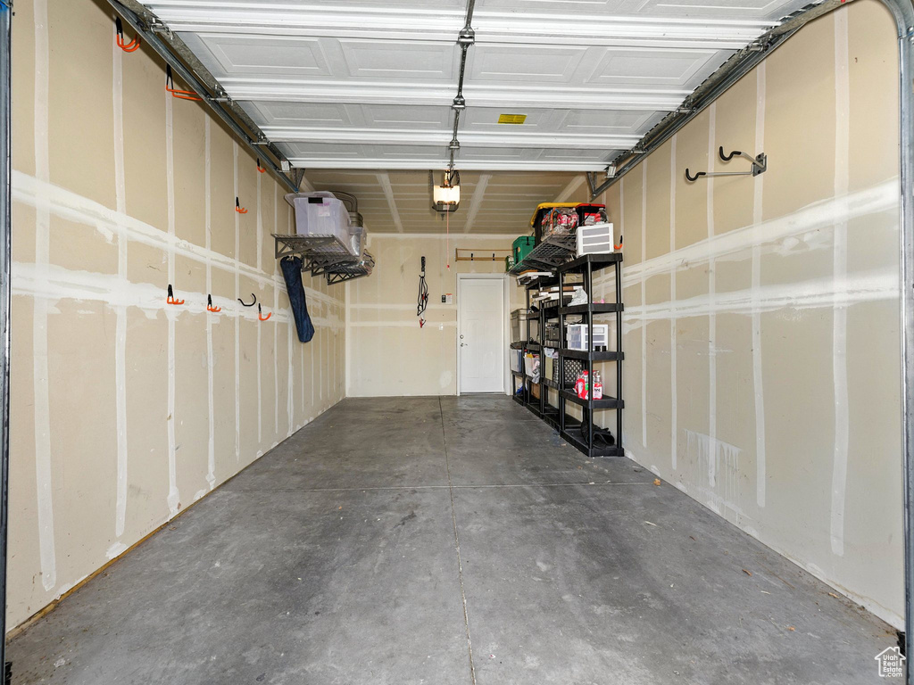 Garage featuring a garage door opener
