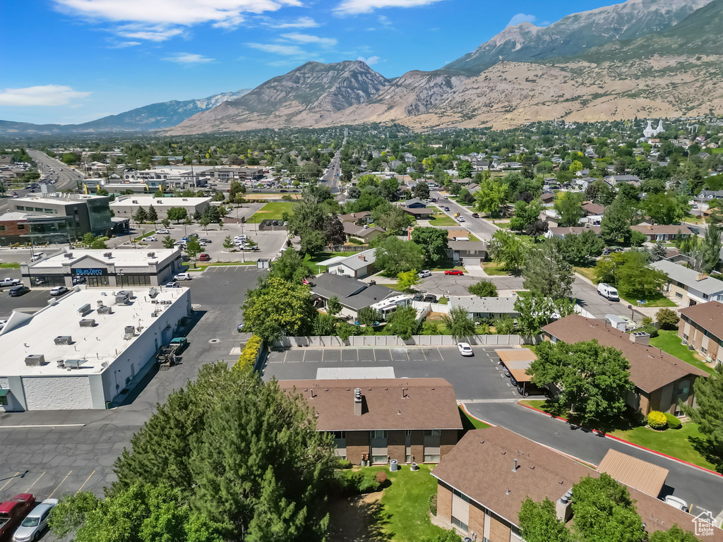 Aerial view of residential area featuring a mountainous background