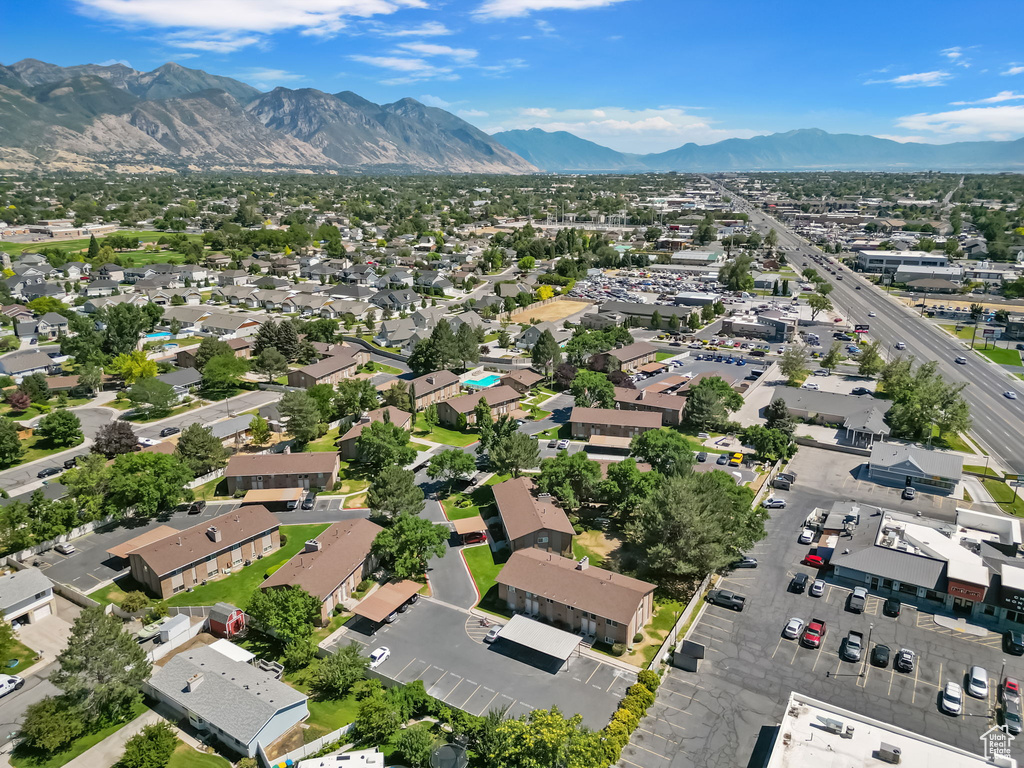 Aerial view of property\'s location featuring a mountainous background and nearby suburban area