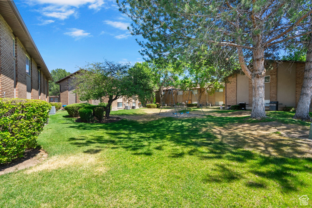 View of green lawn featuring a patio area