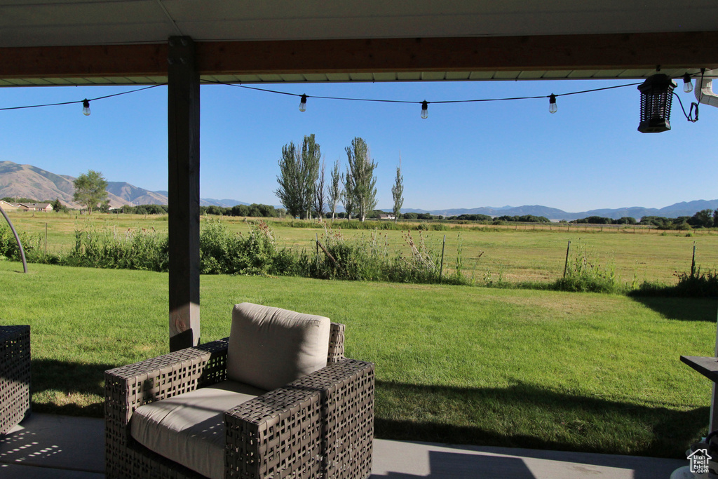 View of grassy yard with a view of countryside and a mountain view